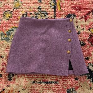 Cute and stylish purple skirt with gold button detailing